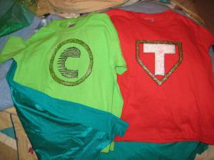 Dec 2013: Super-hero t's for friends and kidlet; just fabric paint on shirt, and removable snap-on cape at the shoulders. T-shirts from Michaels.